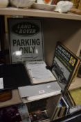 A selection of Land Rover items including Defender service manual, Ninety. One Ten Workshop manual