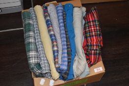 A selection of mens button up shirts in cheque and similar patterns