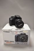 A Canon EOS 1000d camera with Canon zoom EF-S 18-55 f3,5-5,6 len