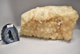 Two geological semi precious stone mineral samples largest aprox 40cm long with a blue geode