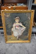 An embroidery of a young girl in a gilt and gesso frame