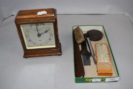 An Edwardian mantel clock by Elliott marked Northern Goldsmiths, with assorted hardware