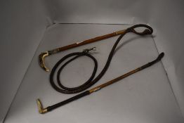Two 20th century hunters or horse riders crops one having whip attachment with white metal collar