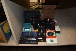 A selection of cameras and optical devices including Super Zenith 10x50 binoculars etc