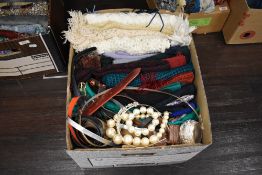 A selection of ladies scarves, shawls, belts and textiles