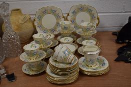 A part tea service by Royal Stafford in an Art Deco design having hand painted blue poppy design