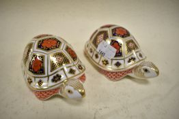Two Royal Crown Derby Tortoise studies having silver stoppers.