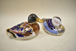 Two Royal Crown Derby studies of ducks, one having silver stopper the other gold.