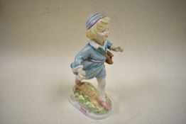 A figure by Royal Worcester titled Thursdays child has far to go