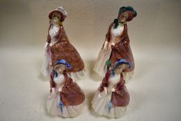 Four Royal Doulton figurines, 'Paisley shawl' in varying colour ways.