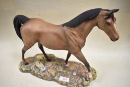 A Royal Doulton study, The Champion on ceramic base, brown, matt