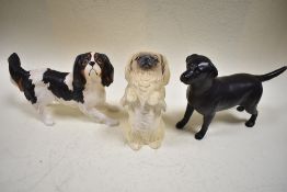 Three Beswick studies, Labrador, black, matt, 1548, Pekinese, begging, matt 2982 and King Charles