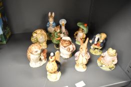 Eleven Beswick Beatrix potter studies to include some gold labelled examples such as old Mr Brown