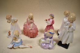 Seven Royal Doulton figurines, to include; My pet, Bedtime and Darling.