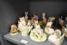 A collection of Royal Albert and Beswick Beatrix Potter studies, to include; Miss Moppet, Peter in