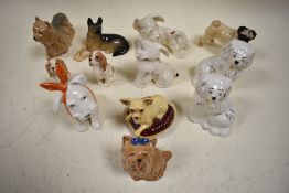 A collection of Beswick Dog studies, Dog with Tooth Ache 761 (af), Chihuahua on Cushion 2454, pair