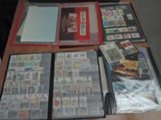 A collection of mainly mint GB Stamps in three albums and one Stock Books includes Presentation