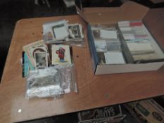 A collection of vintage UK Postcards divided into Counties and box of vintage and modern Postcards