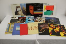 A lot of sixteen album with titles by Genesis , Dire Straits and more