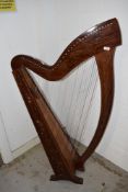 A traditional harp, having Celtic style inlay and foliate applique decoration