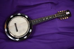 An early 20th Century banjo mandolin , J E Dallas maker, stamped 415 Strand, serial number 5685,