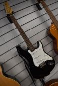 An Encore electric guitar , Stratocaster copy, with Westfield gig bag