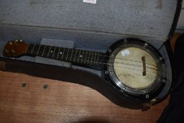 An early 20th Century banjo ukulele in semi hard case