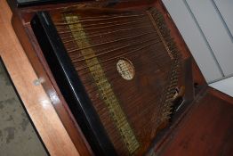 A late 19th or early 20th Century piano harp, in wooden case