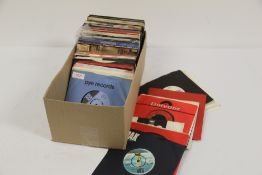 A box of unplayed deadstock 45's - sixty approximately - most from late 70's / early 80's