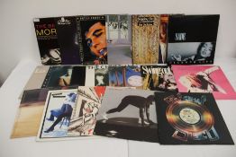 A lot of eighteen vinyl albums - rock , pop and more on offer here