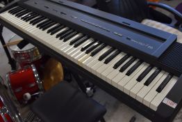 A Roland digital piano, model eP-7 IIe, no power supply
