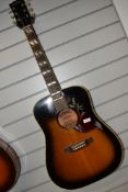 A Magenta acoustic guitar