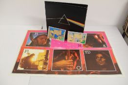 A UK copy of Pink Floyd's ' DSOTM ' with all relevant inners - postcards and posters - unused -