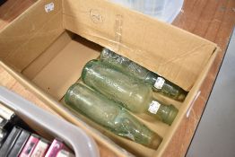 Three advertising glass bottles