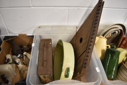 A zither, an ammunition case and enamel pot