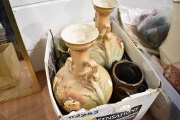A pair of early 20th century urns having floral decoration and handles to sides, also included are