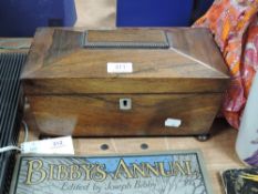 A Victorian rosewood casket form tea caddy on bun feet