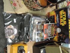 A Star Wars saga edition chess set with Trivial Pursuit, Collectors card, T shirt and a collection