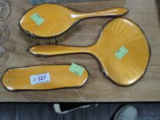 A orange guilloche backed dressing table set.