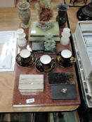 A selection of stone carved items including dog of Fo, turned marble vase and red marble plinth