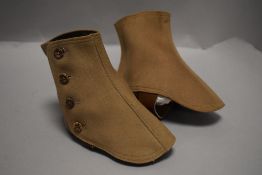 A pair of Gaiters, button fastening to sides, leather strap to base