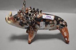 A 20th century Stanislas Mexican figure of a boar AF having one tusk missing