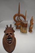 Four pieces of tribal African wooden art works including mask, figure and sculpture