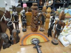 A selection of African tribal wood figures including Ashanti style fan and Ebony heads