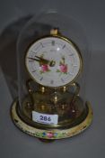 A 20th century brass and glass domed anniversary clock