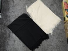 Two antique fringed shawls,wool or wool blend,one cream the other black.