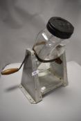 A mid century aluminium and glass butter churn