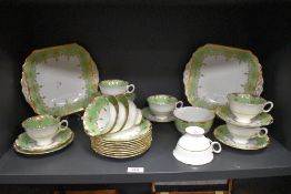 An early 20th century Radfords Fenton ' Naples ' tea service with gilt and green design