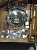 A selection of local interest Lakeland Rural Industries metal wares including bowls, candle