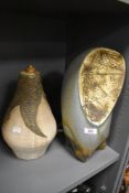 Two mid century studio pottery lamp bases one of typical design and similar slipware cast having
